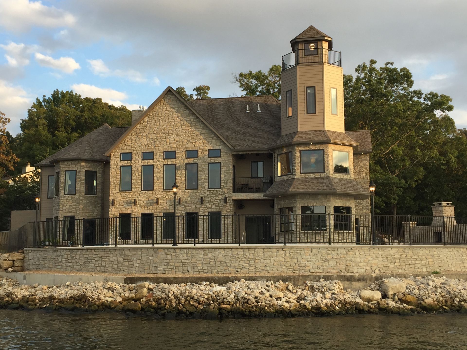 A large house with a lighthouse on top of it