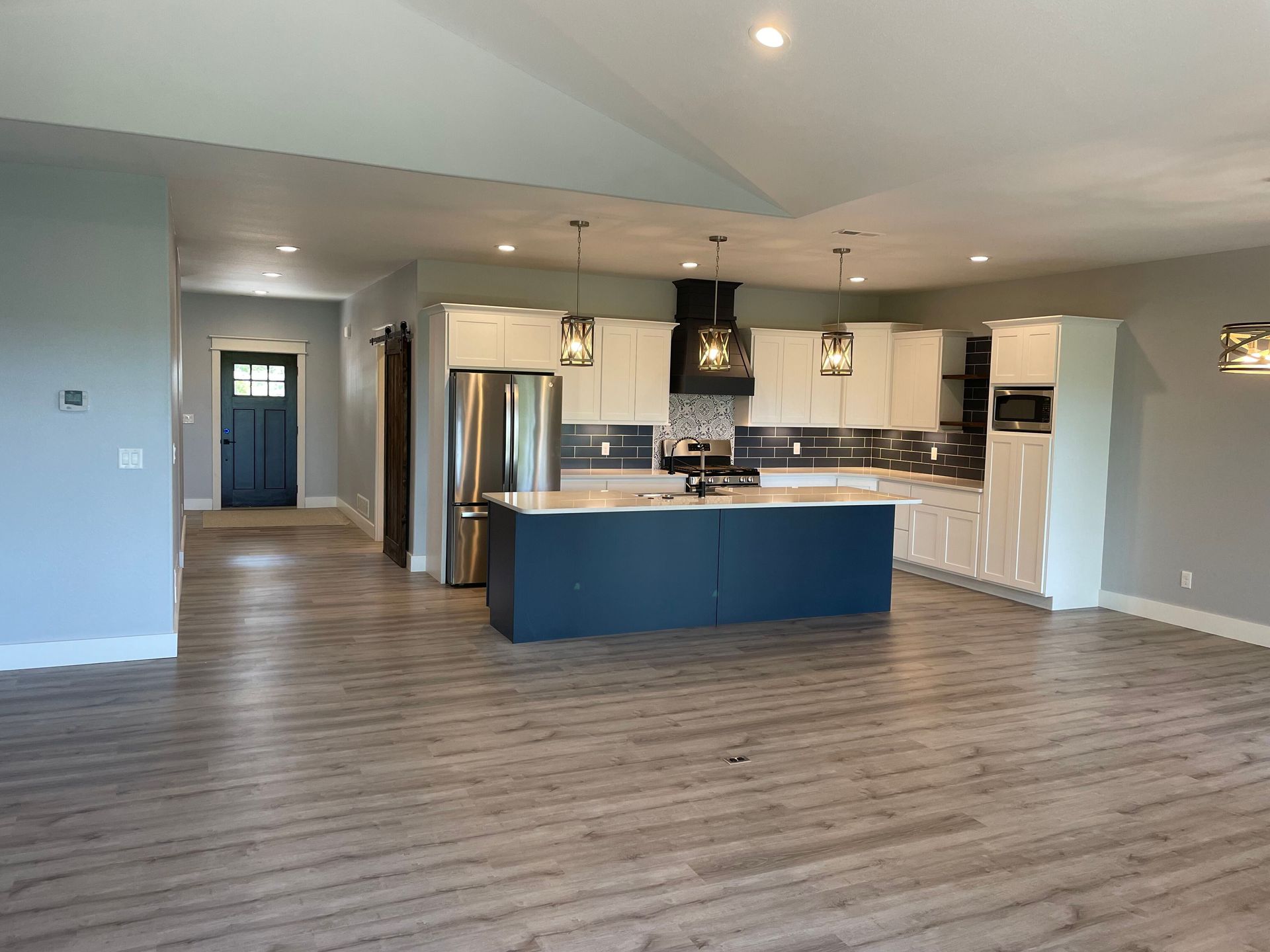 A kitchen with a large island in the middle of the room.