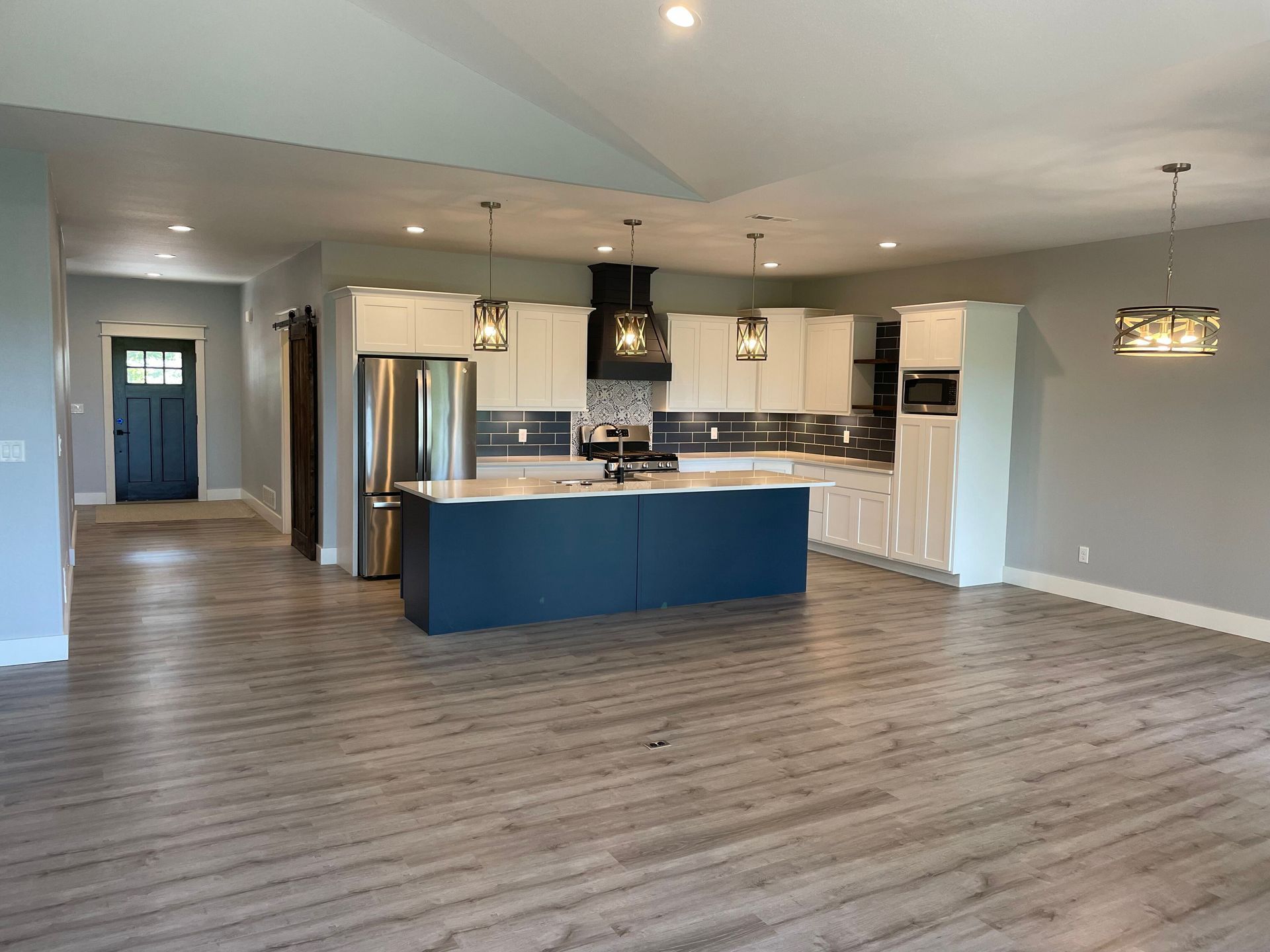 A kitchen with a large island in the middle of the room.