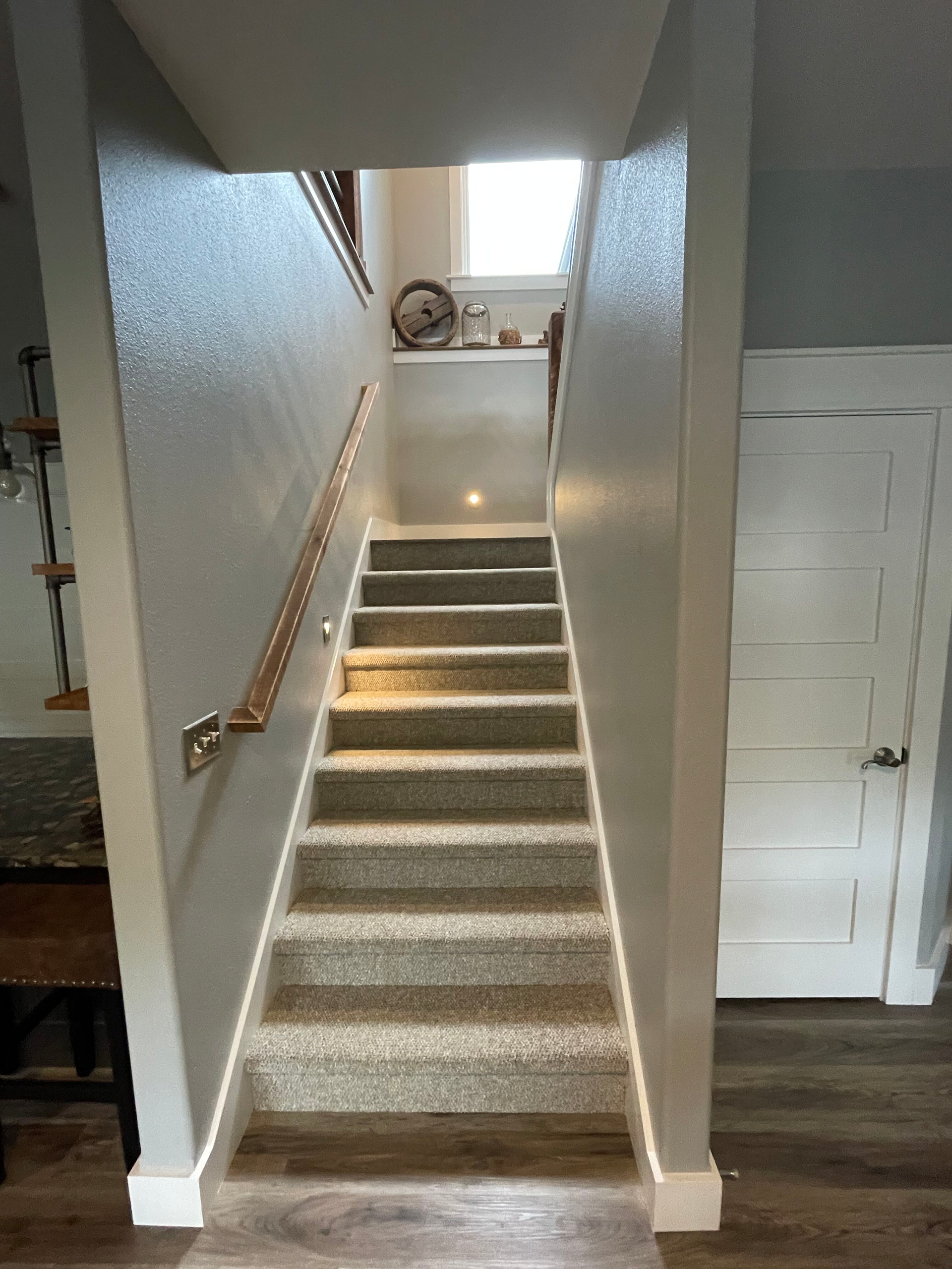 A set of stairs leading up to the second floor of a house.