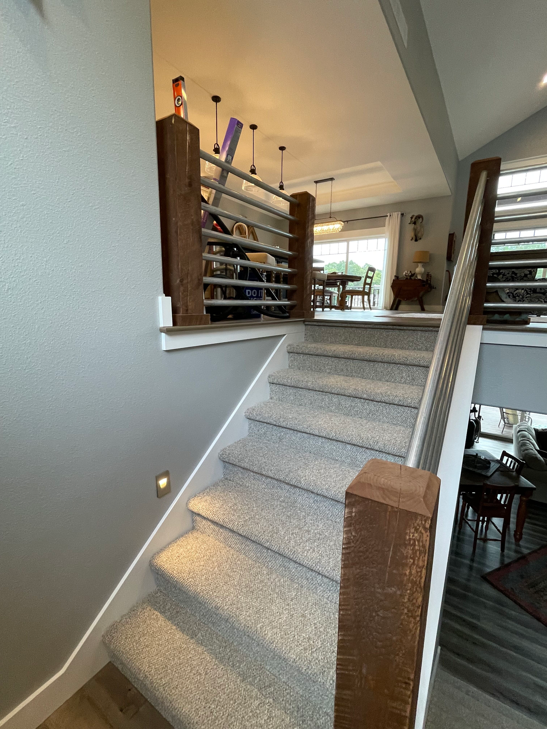 A set of stairs leading up to a second floor in a house.