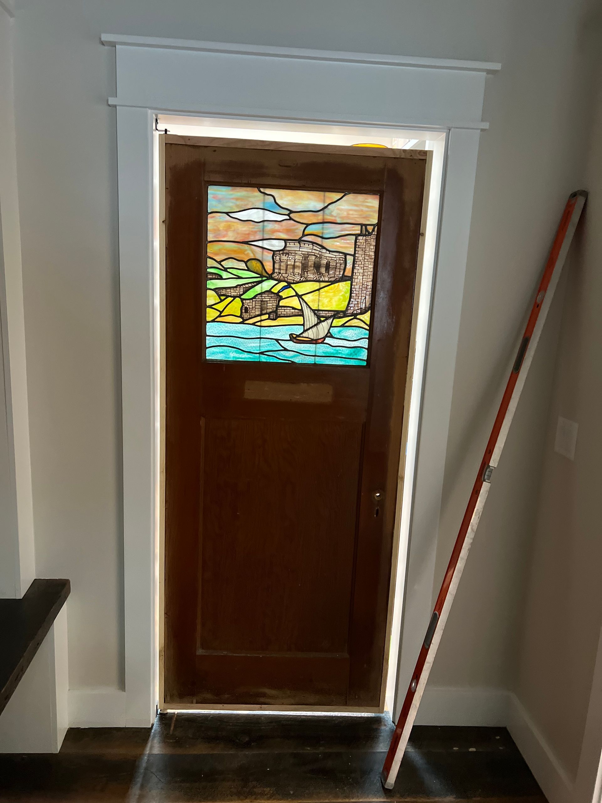 A door with a stained glass window in it