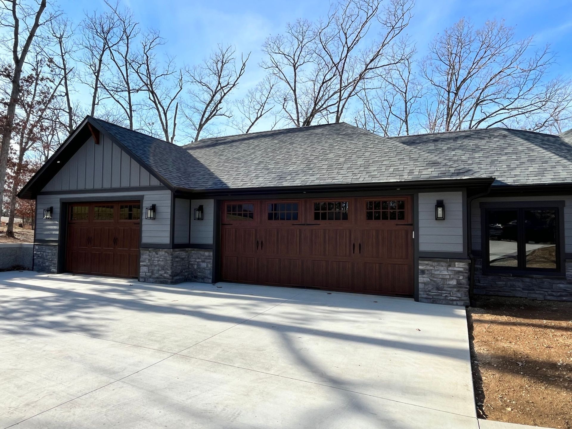 A house with two garage doors and a driveway