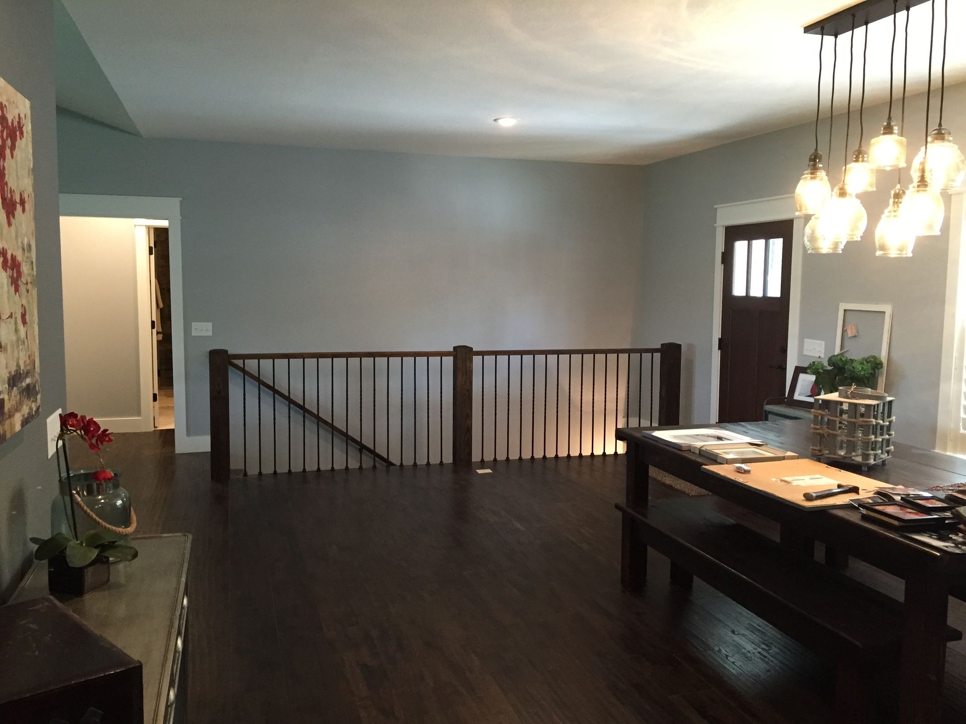 A living room with a wooden table and bench