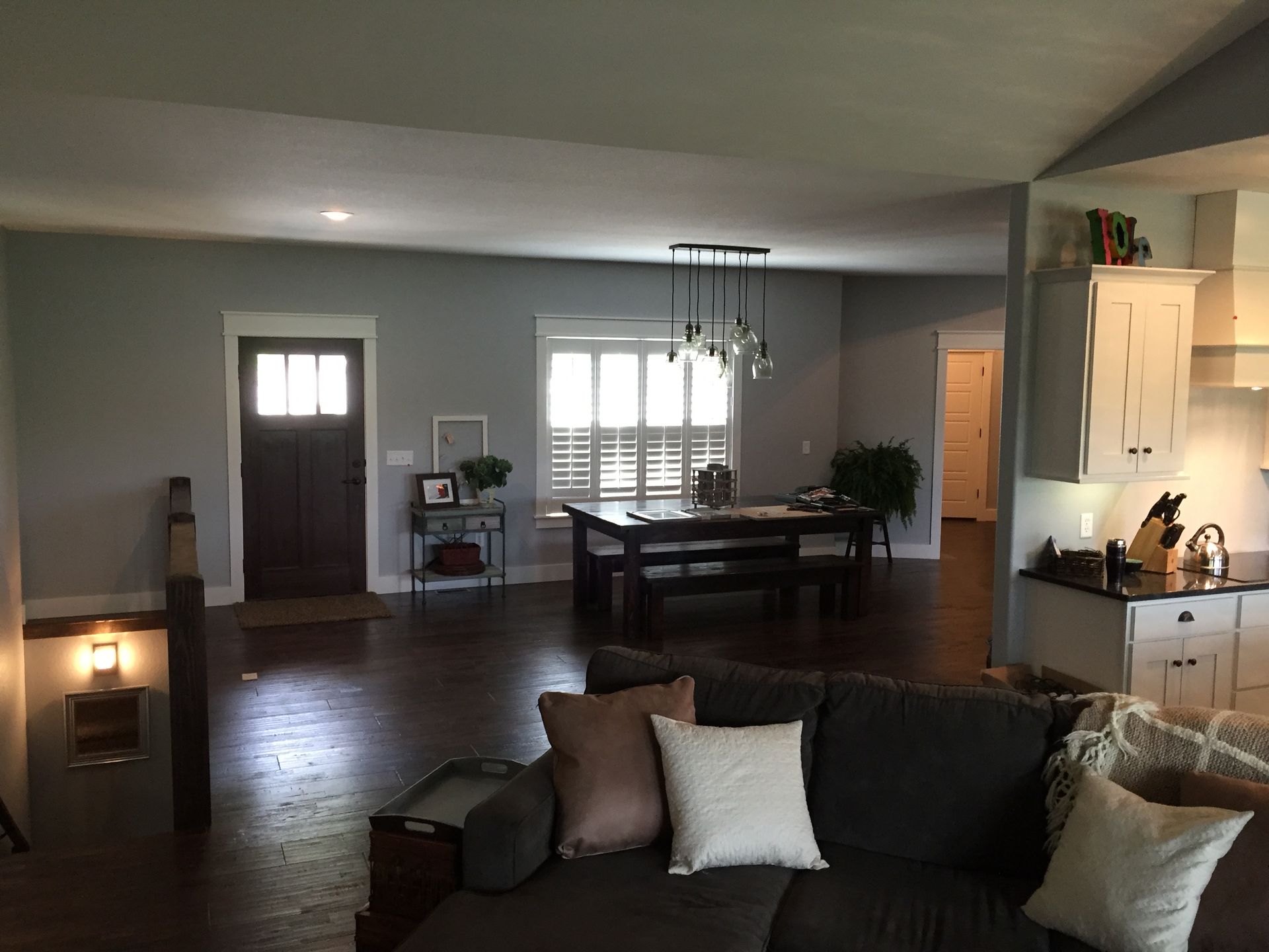 A living room with a couch and a table in it