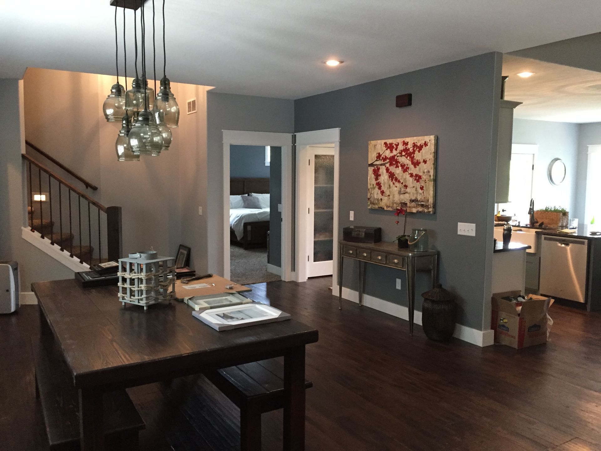 A living room with a wooden table and benches