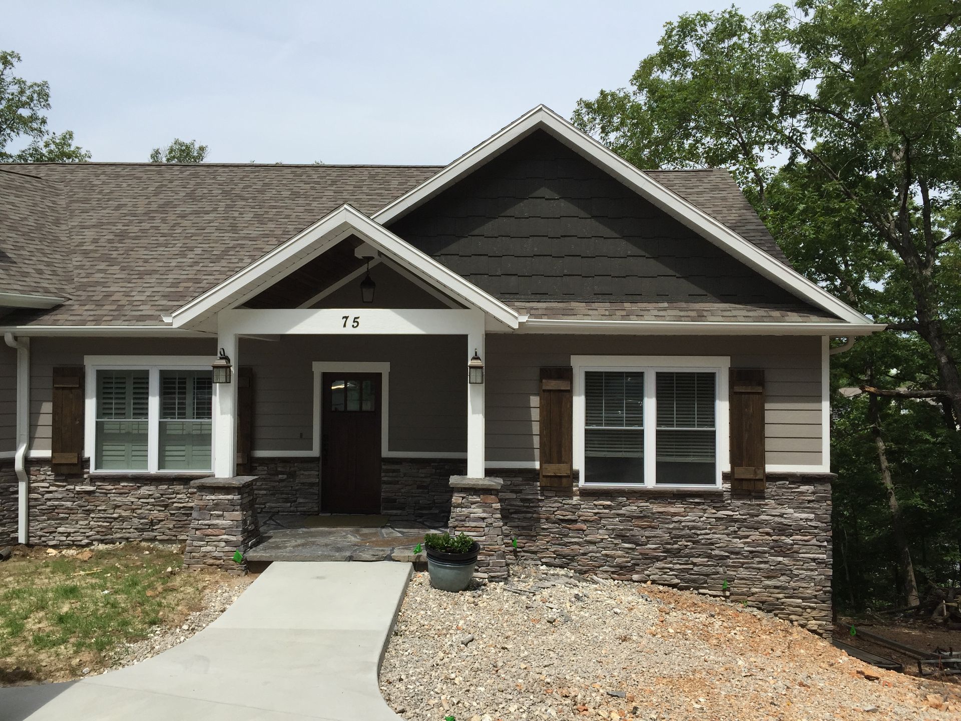 A house with the number 75 on the front of it