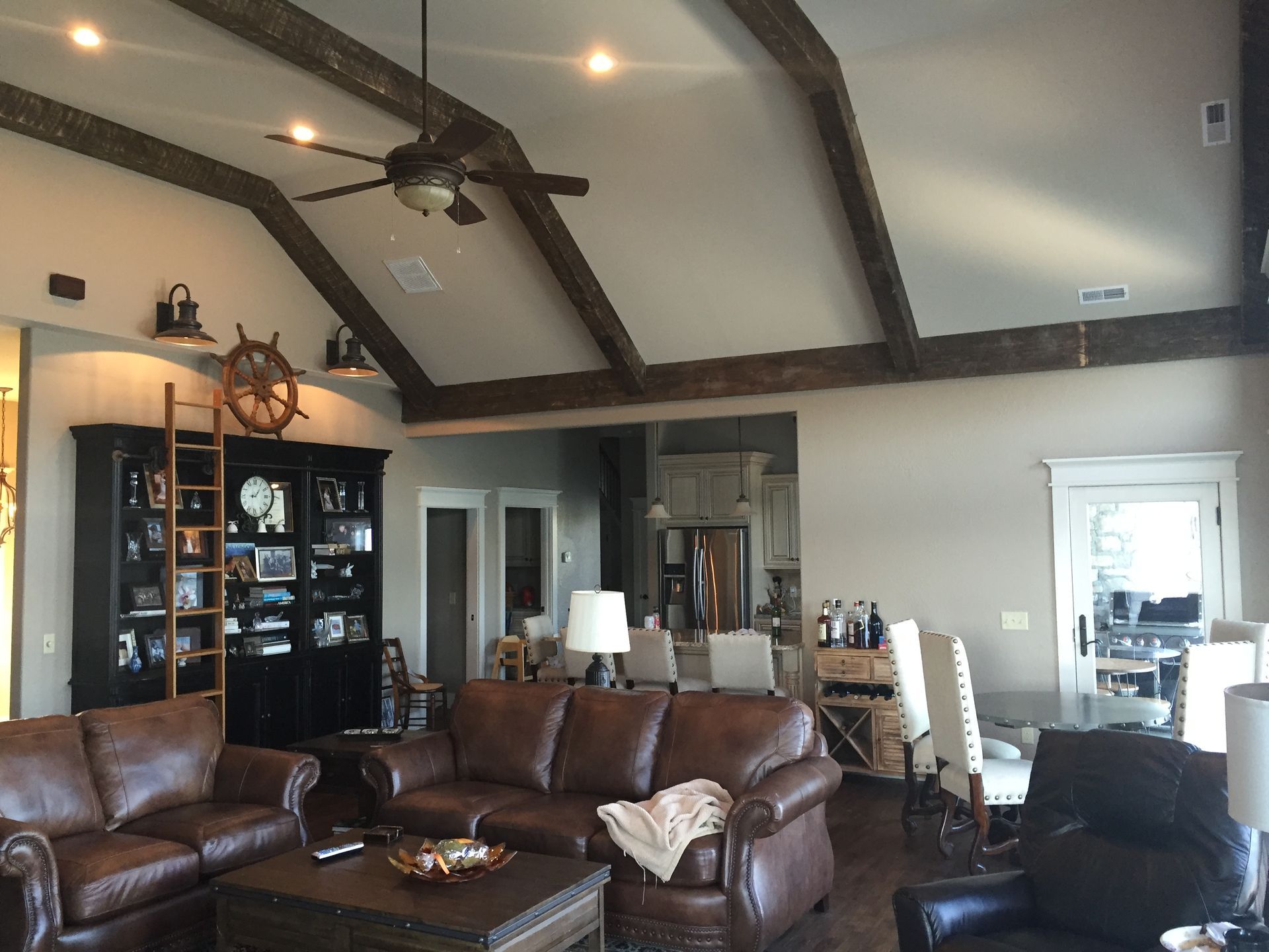 A living room filled with furniture and a ceiling fan