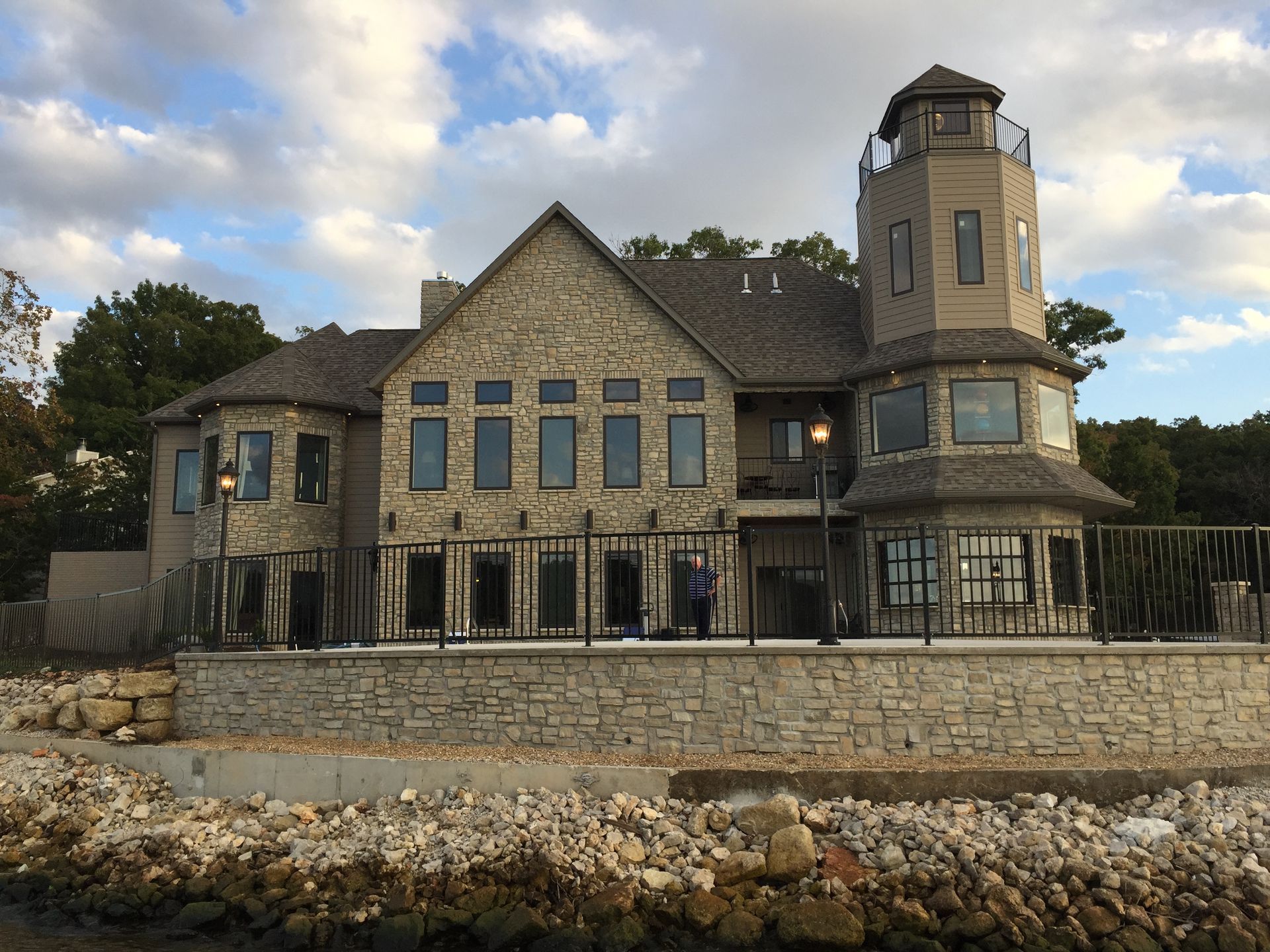 A large house with a lighthouse on top of it
