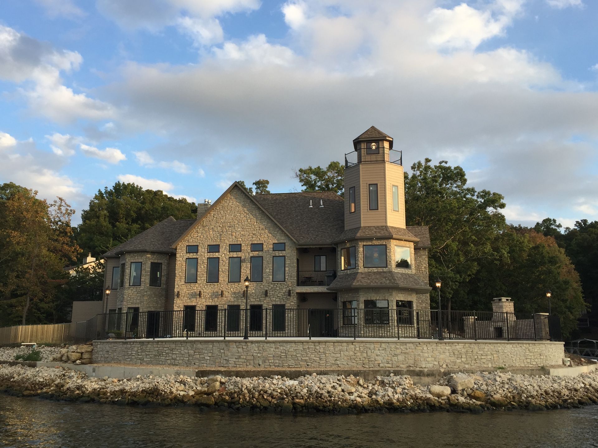 A large house with a lighthouse on top of it