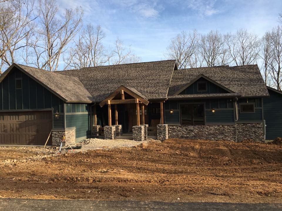 A large house with a lot of dirt in front of it is being built.