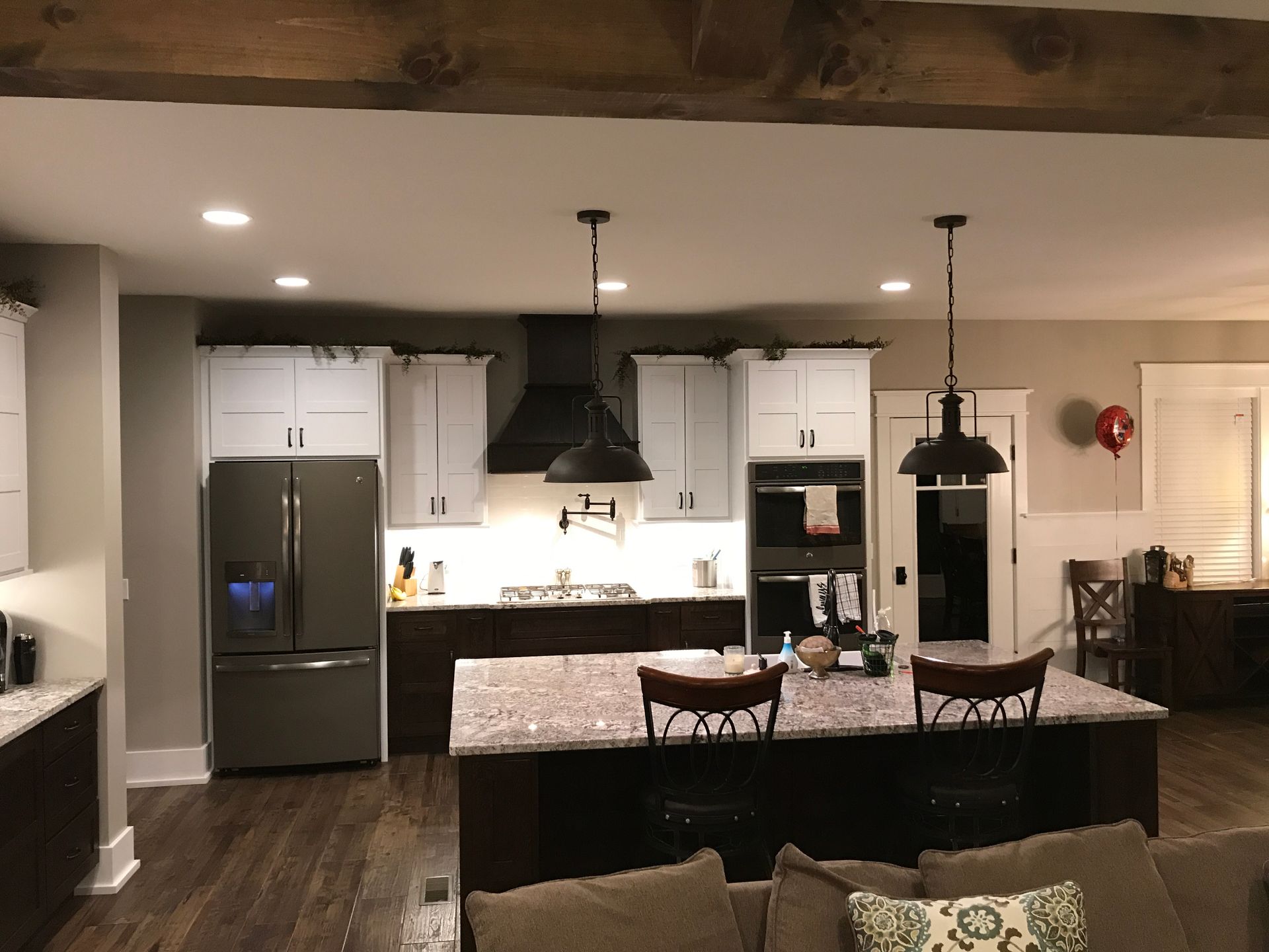A kitchen with stainless steel appliances and granite counter tops