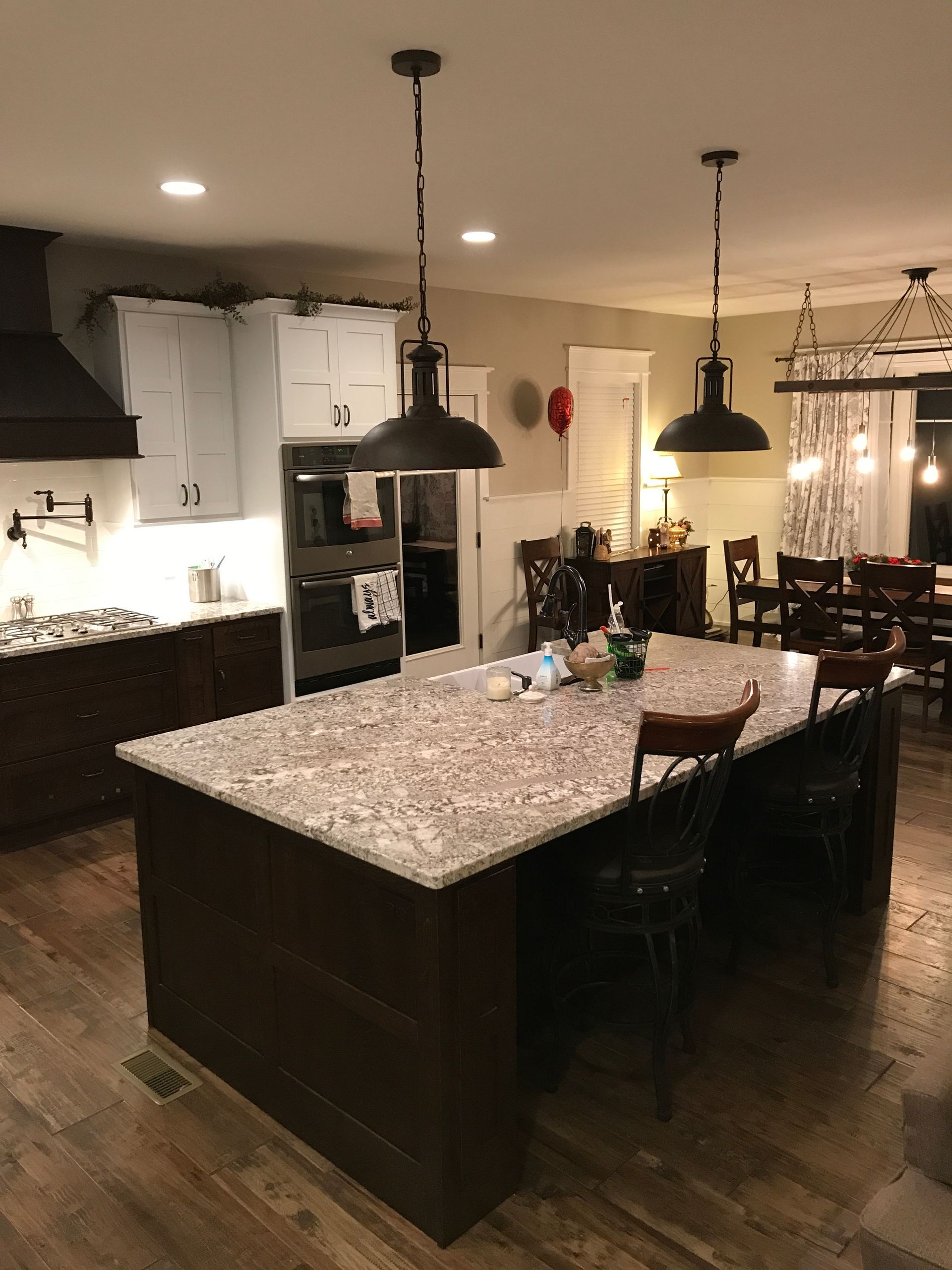 A kitchen with a large island in the middle of it