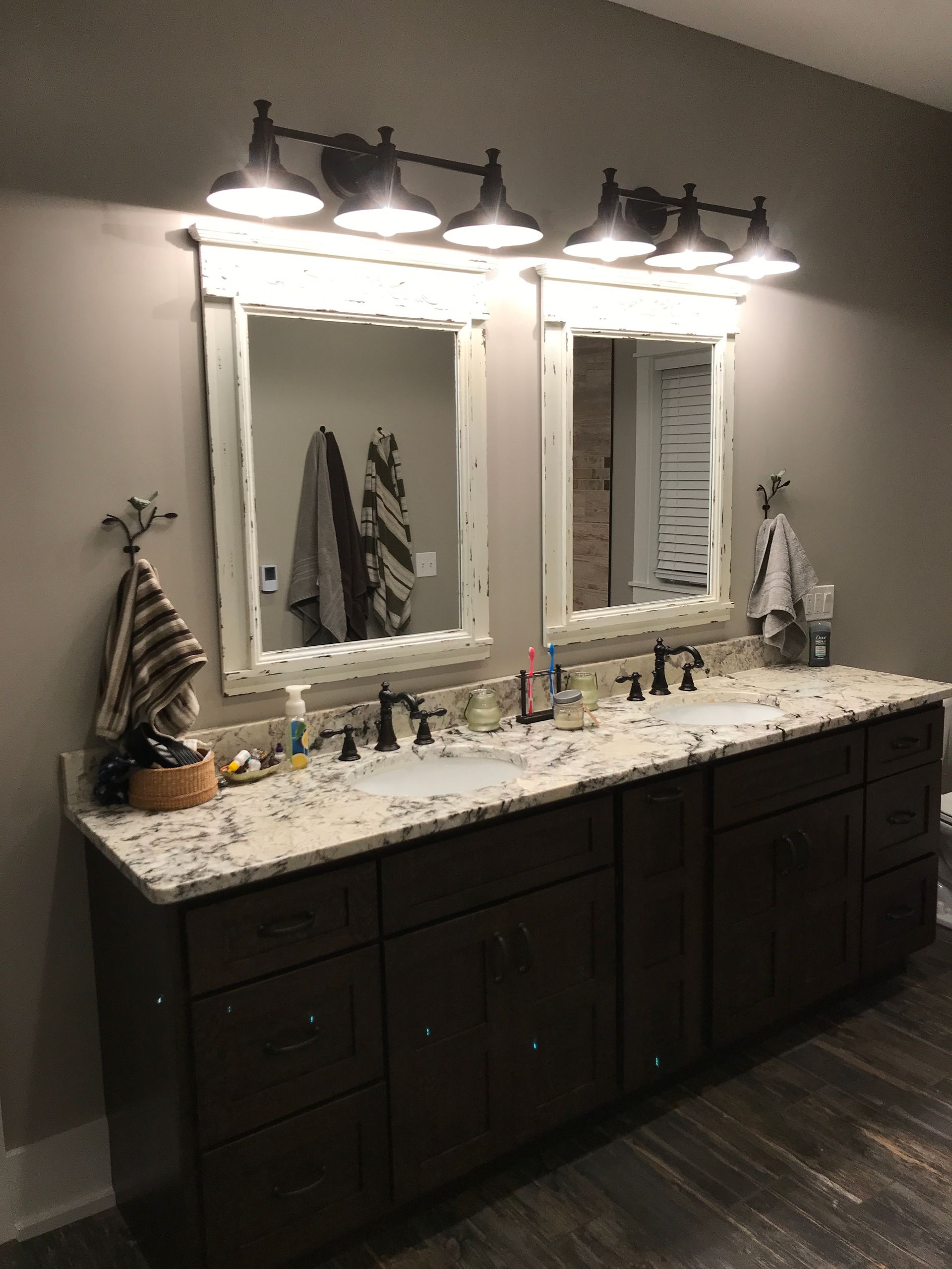 A bathroom with two sinks and two mirrors.
