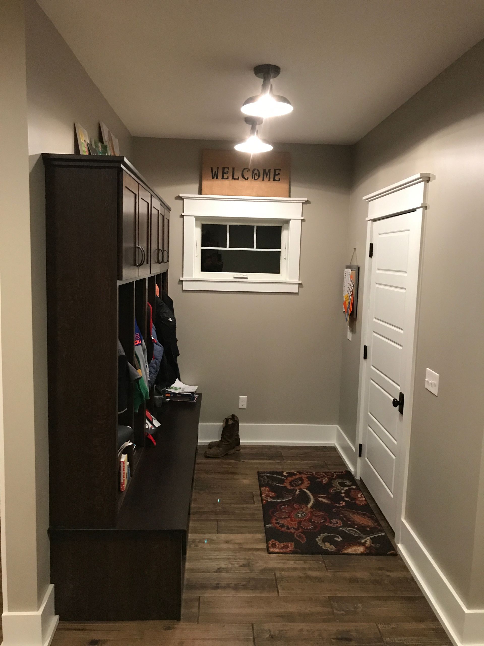 A hallway with a sign that says welcome on it