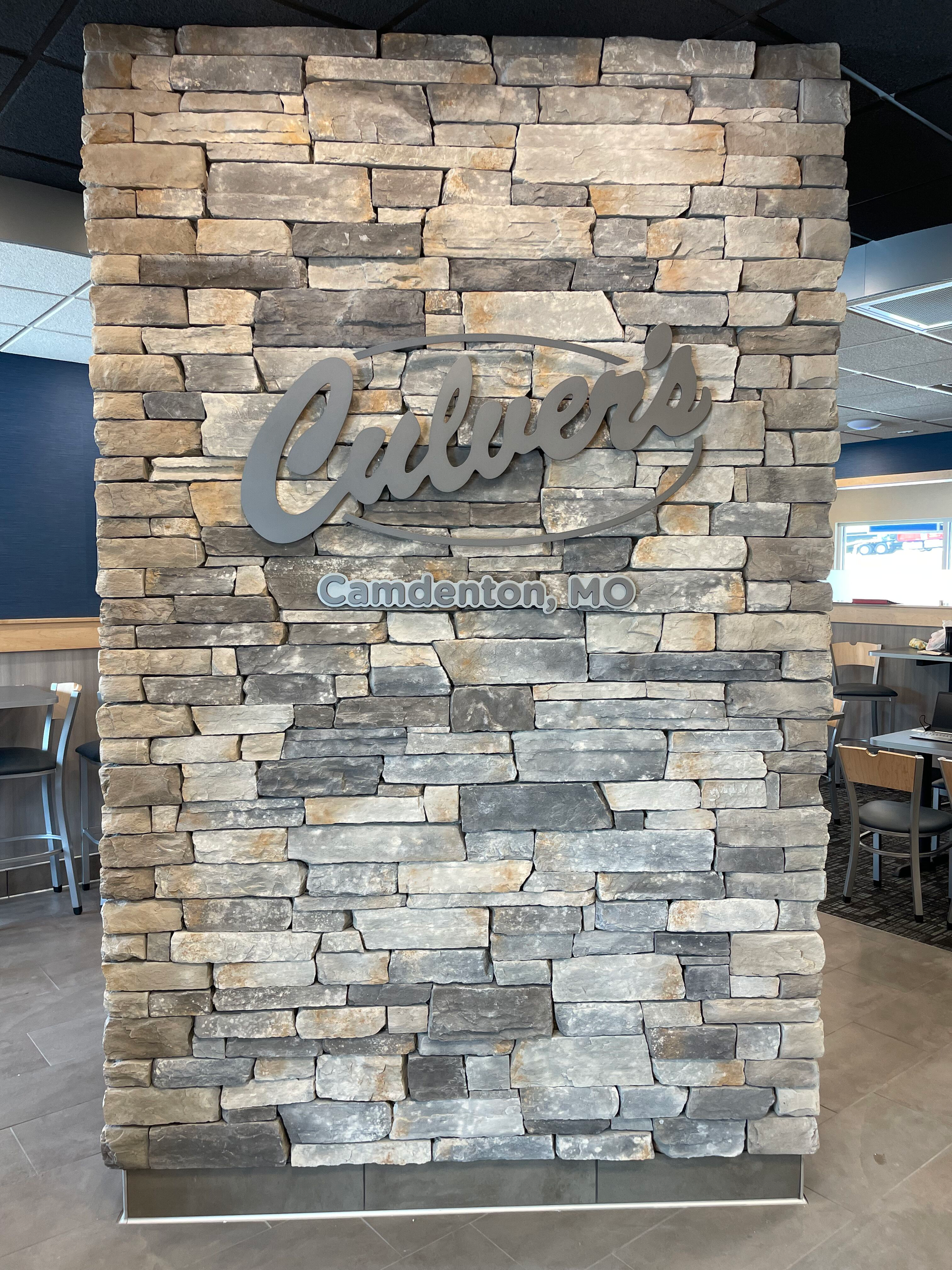 A brick wall with a sign that says calvert 's on it