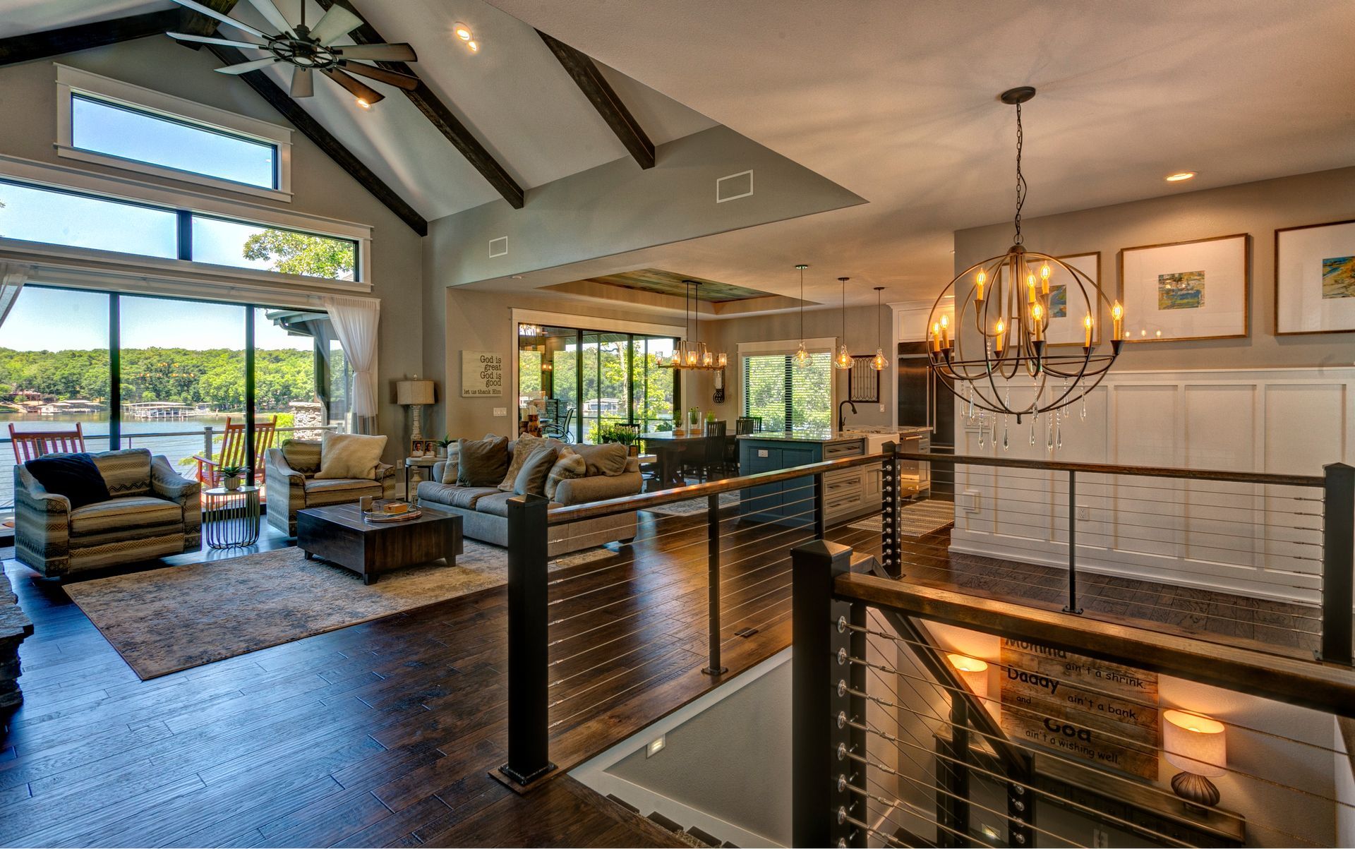 A living room with a lot of furniture and a chandelier.