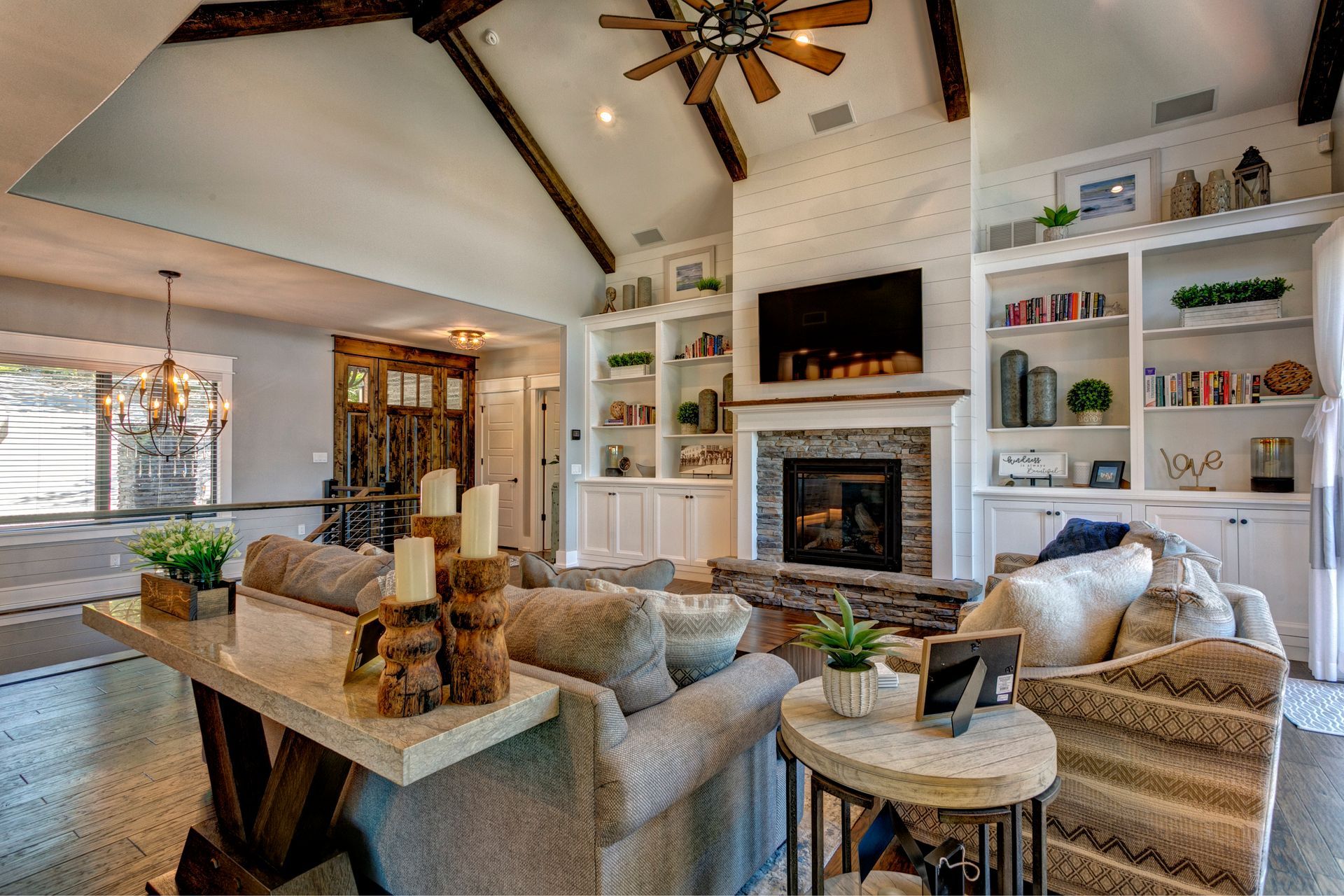 A living room filled with furniture and a fireplace.