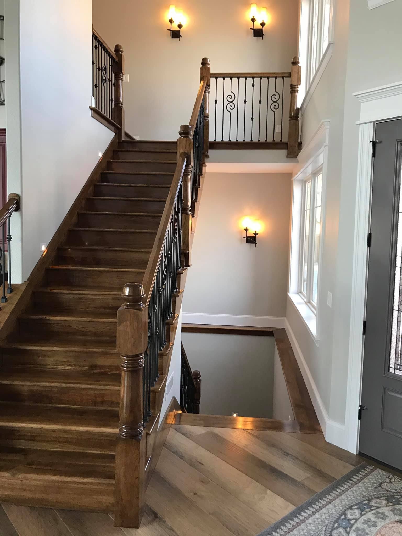 A wooden staircase leading up to the second floor of a house.