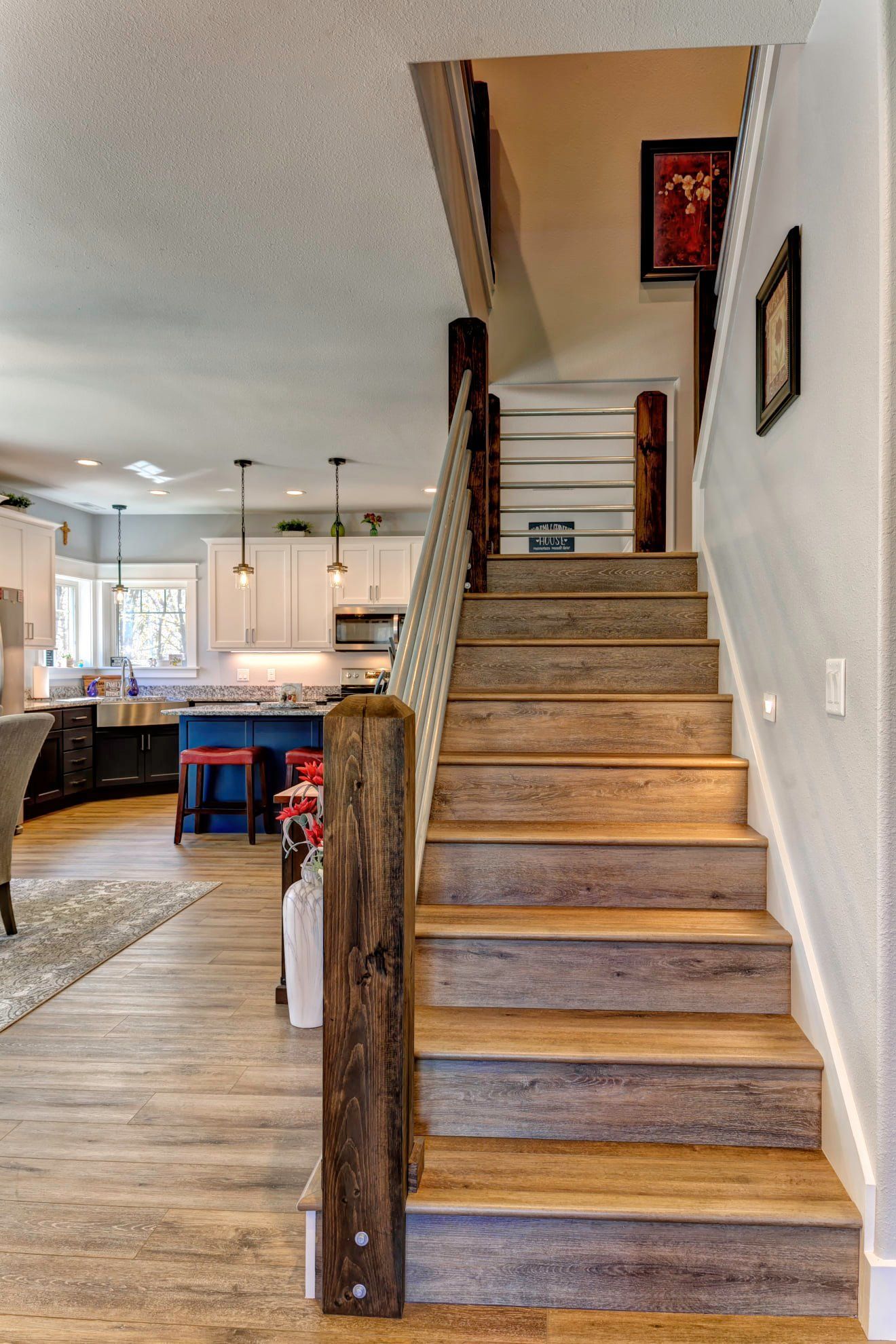 A wooden staircase leading up to the second floor of a house.