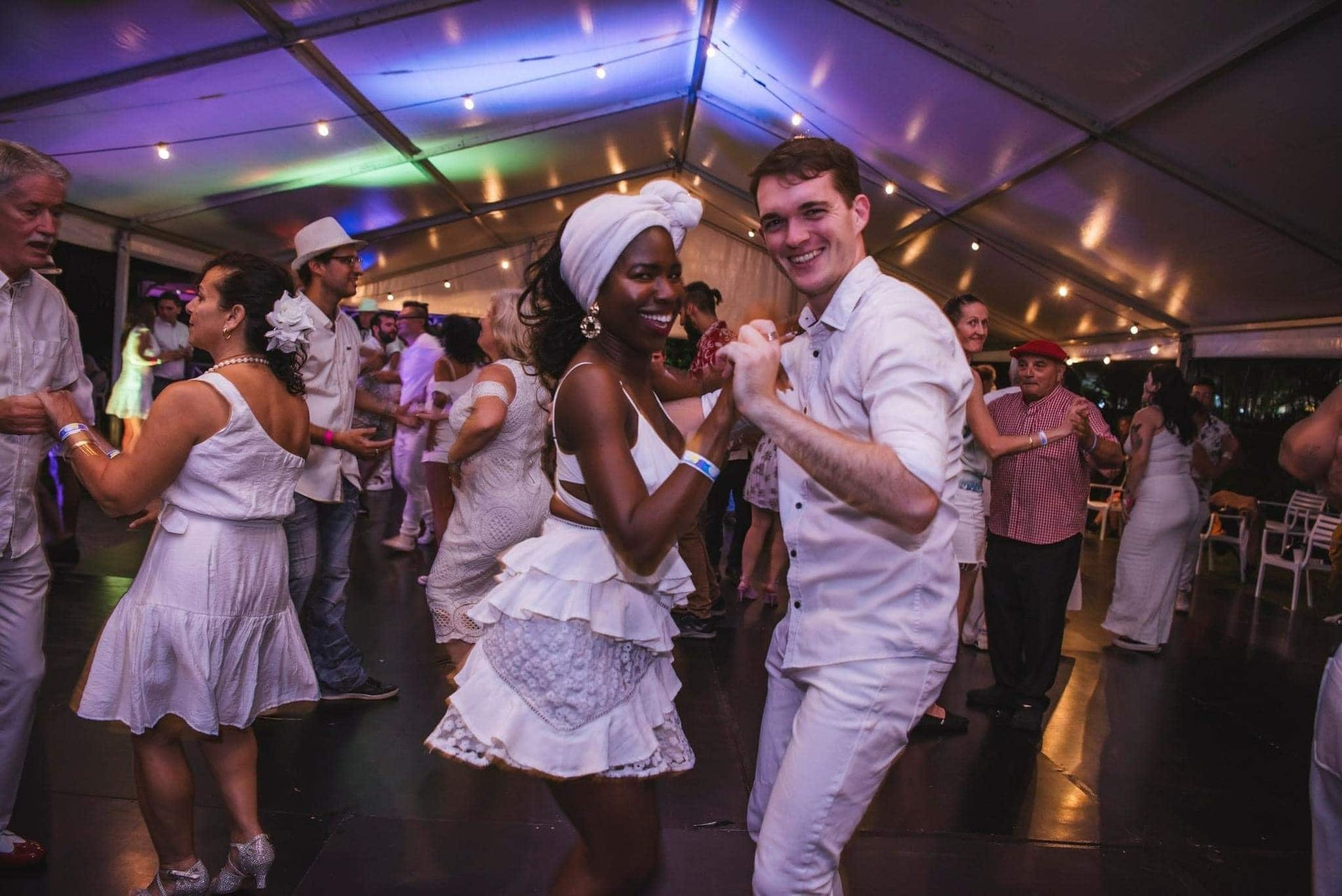 A Group Of People Are Dancing In A Tent At A Party — Global Dance Collective In West End, QLD