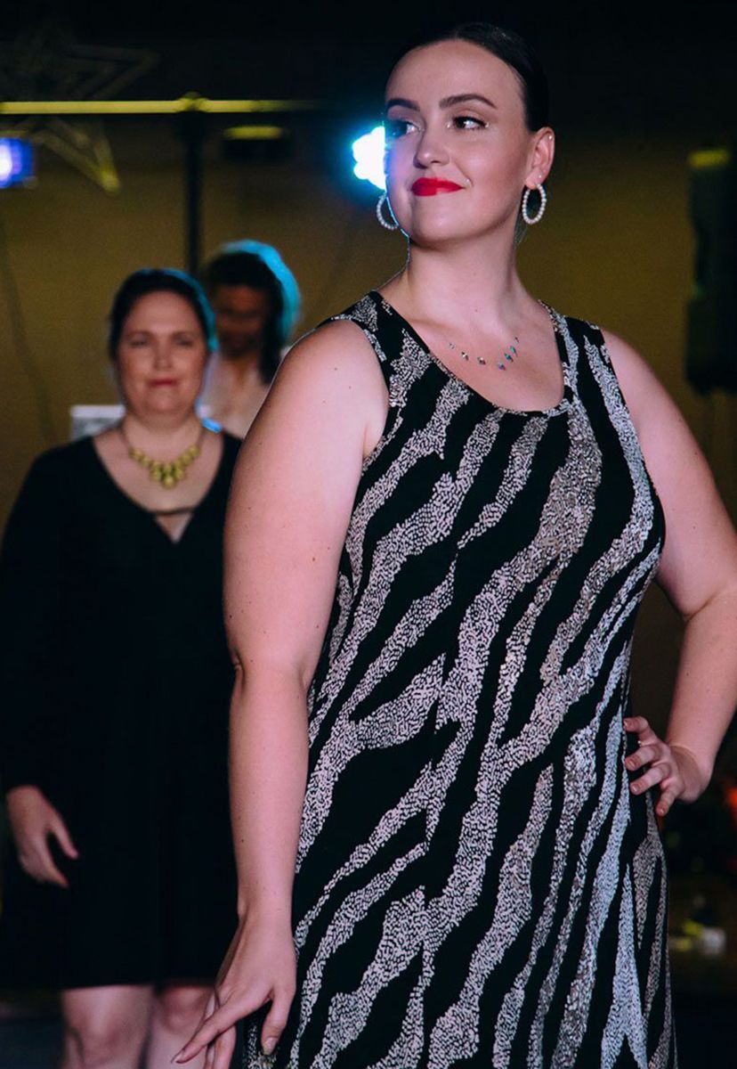 A Woman in a Zebra Print Dress is Walking Down a Runway — Global Dance Collective In West End, QLD