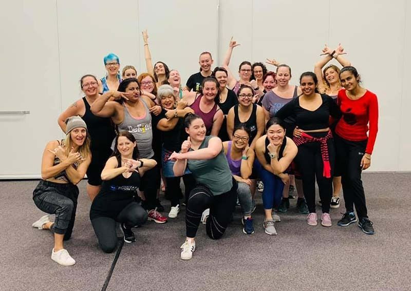 A Group Of Women Are Posing For A Picture In A Gym — Global Dance Collective In West End, QLD