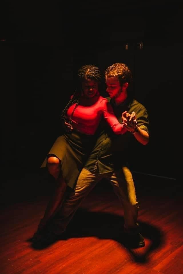 A Man And A Woman Are Dancing Tango In A Dark Room — Global Dance Collective In West End, QLD