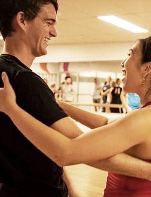 A Man And A Woman Are Dancing Together In A Dance Studio — Global Dance Collective In West End, QLD