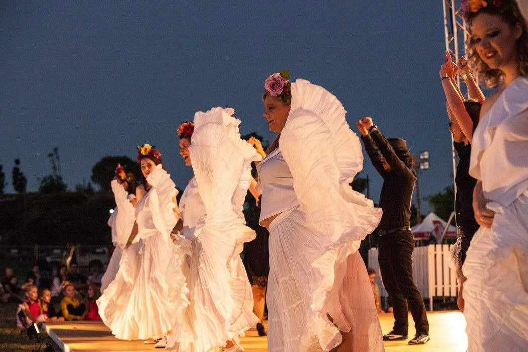 A Group Of Women In White Dresses Are Dancing On A Stage — Global Dance Collective In West End, QLD