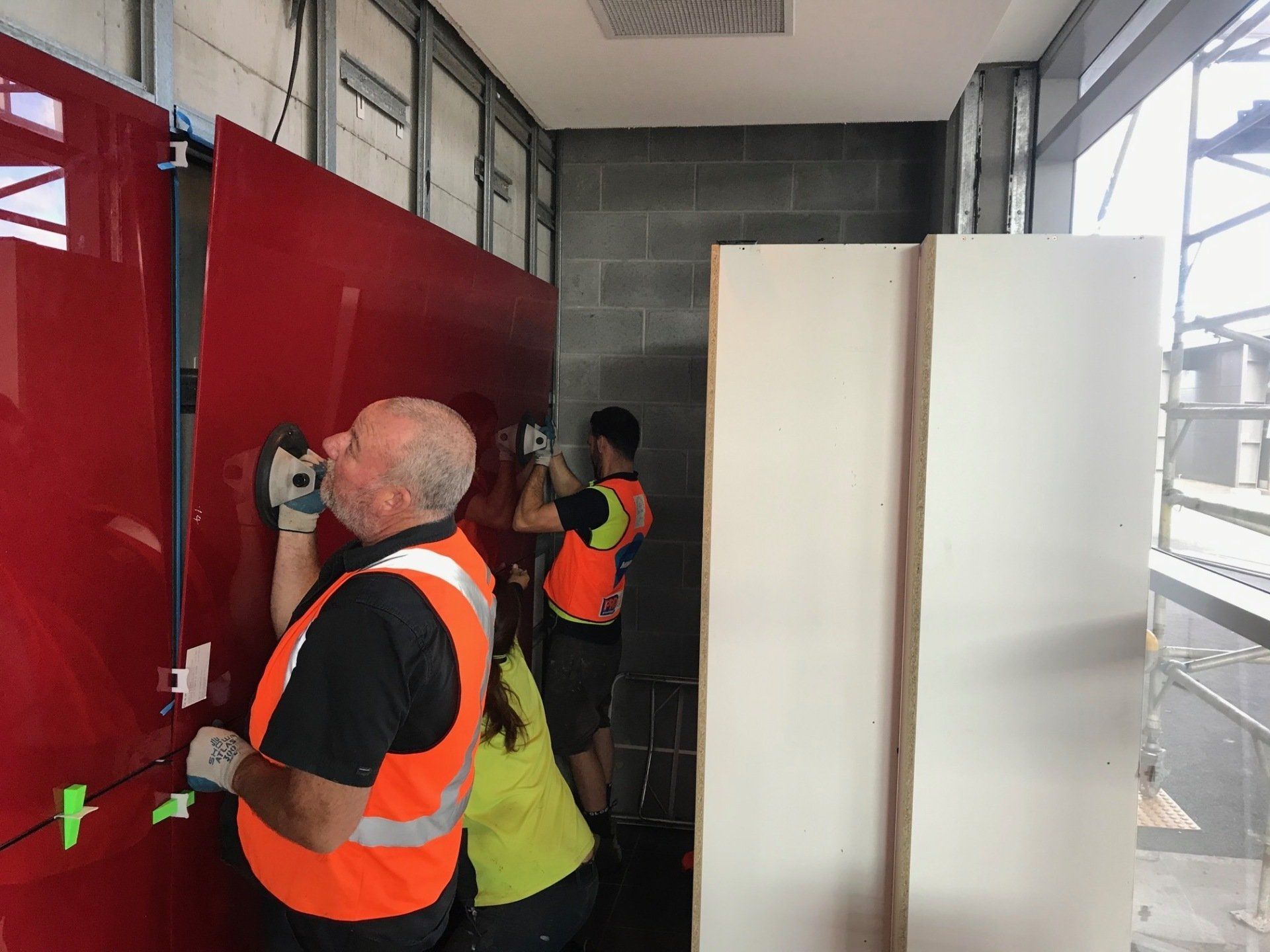 Staffs working on glass — Installing, repairing and manufacturing glass in Cessnock, NSW