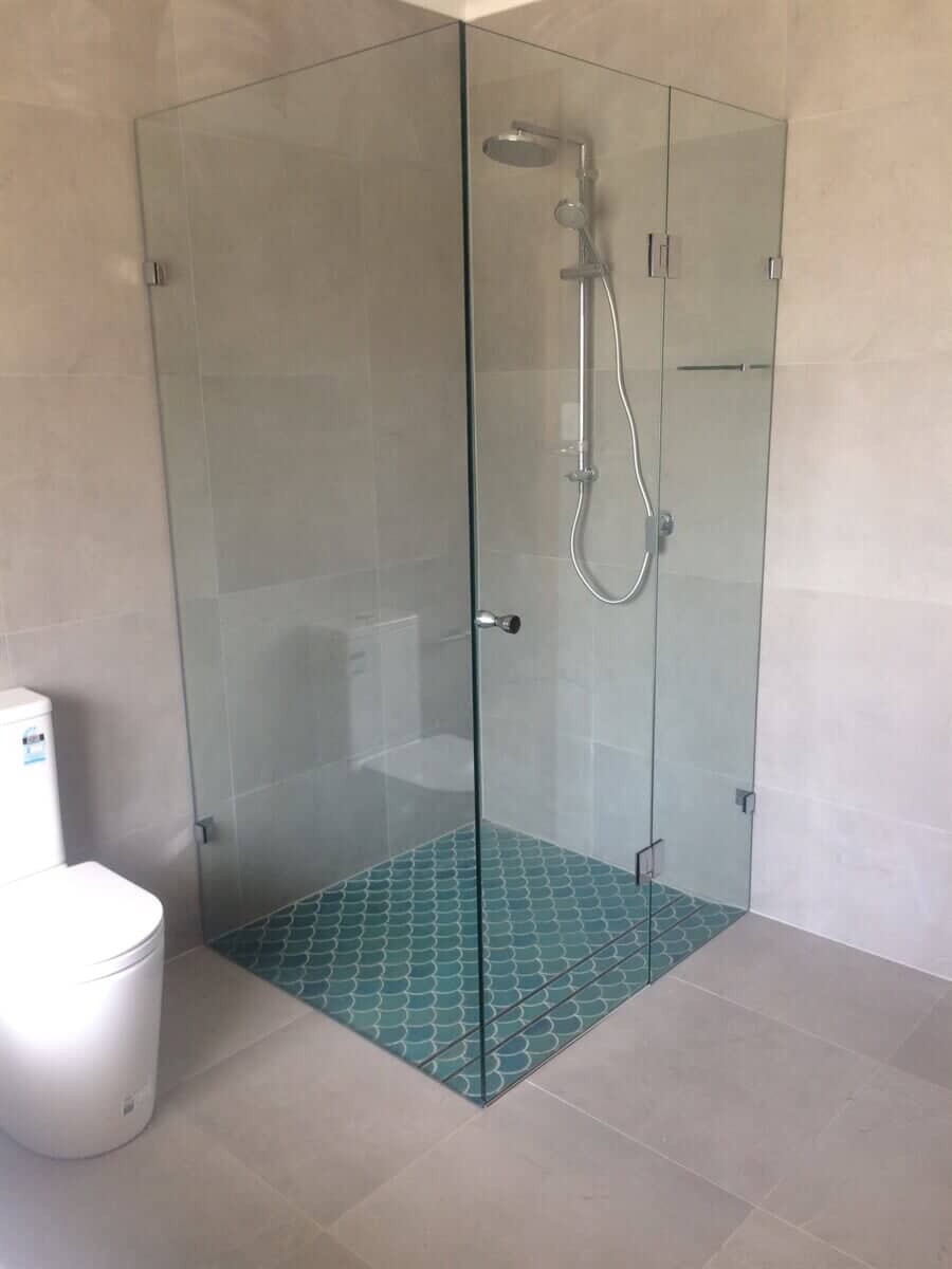 Hinged glass shower screens installed in a new residential home