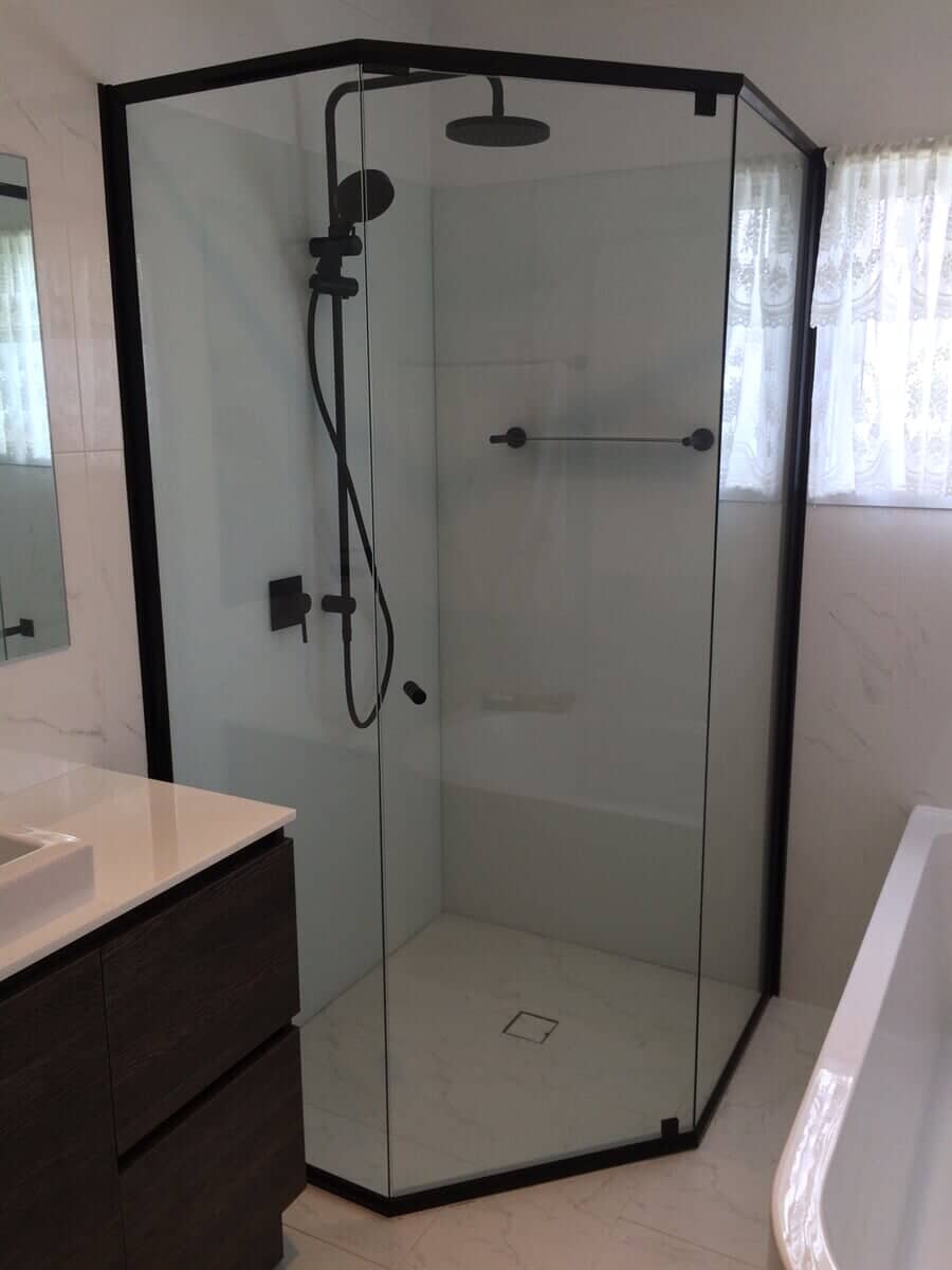 Fully framed shower screen half-octagon shape with stylish black fittings