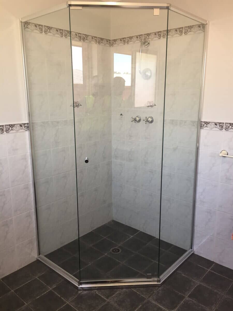 Framed glass shower screen design in a Cessnock residential bathroom 