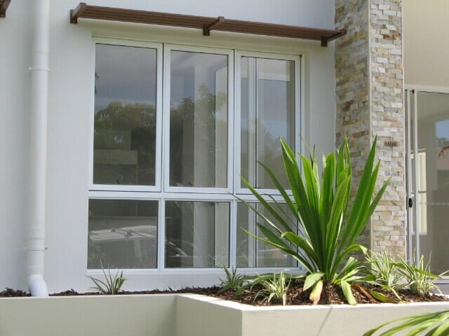 Commercial glass with plants — Installing, repairing and manufacturing glass in Cessnock, NSW