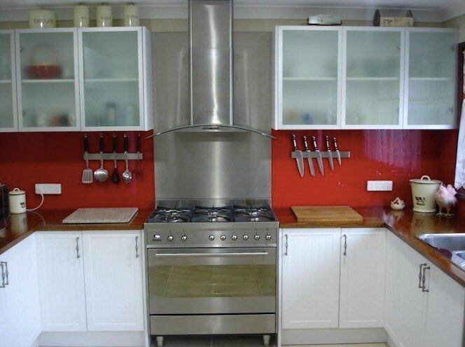 Red coloured splashbacks — Installing, repairing and manufacturing glass in Cessnock, NSW