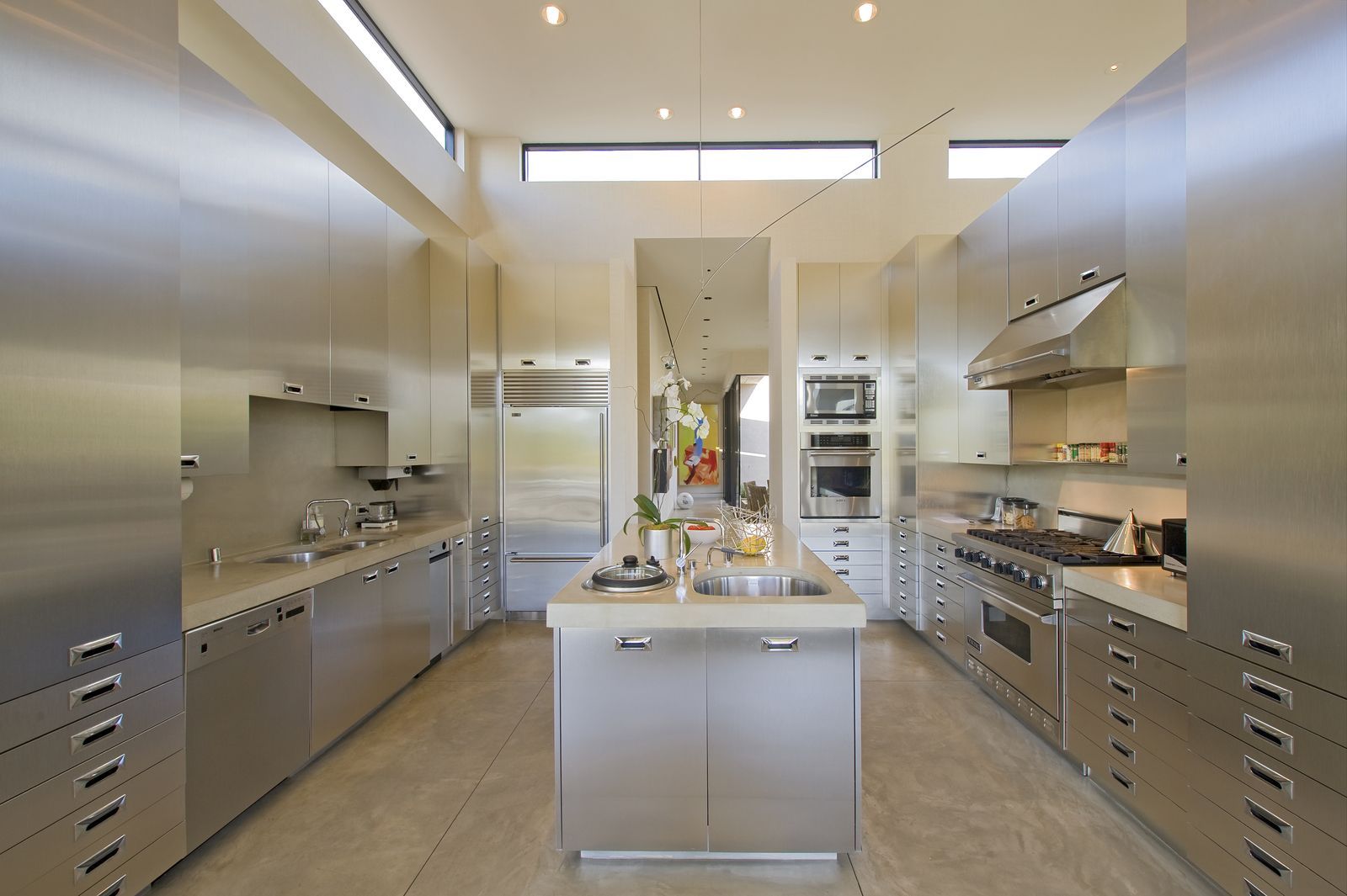 A kitchen with stainless steel cabinets and appliances