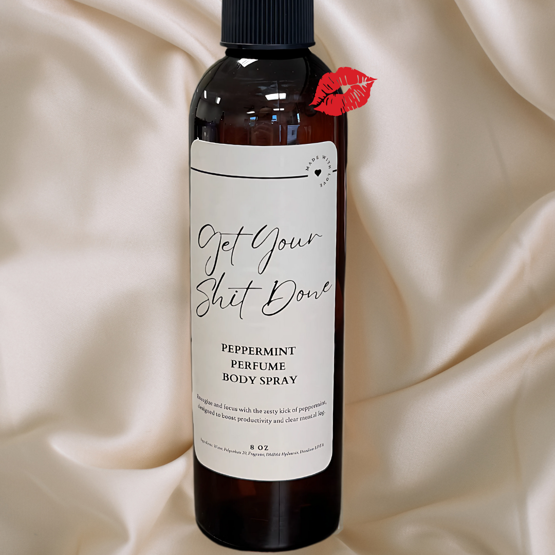 A bottle of peppermint thyme body spray with a kiss on it.