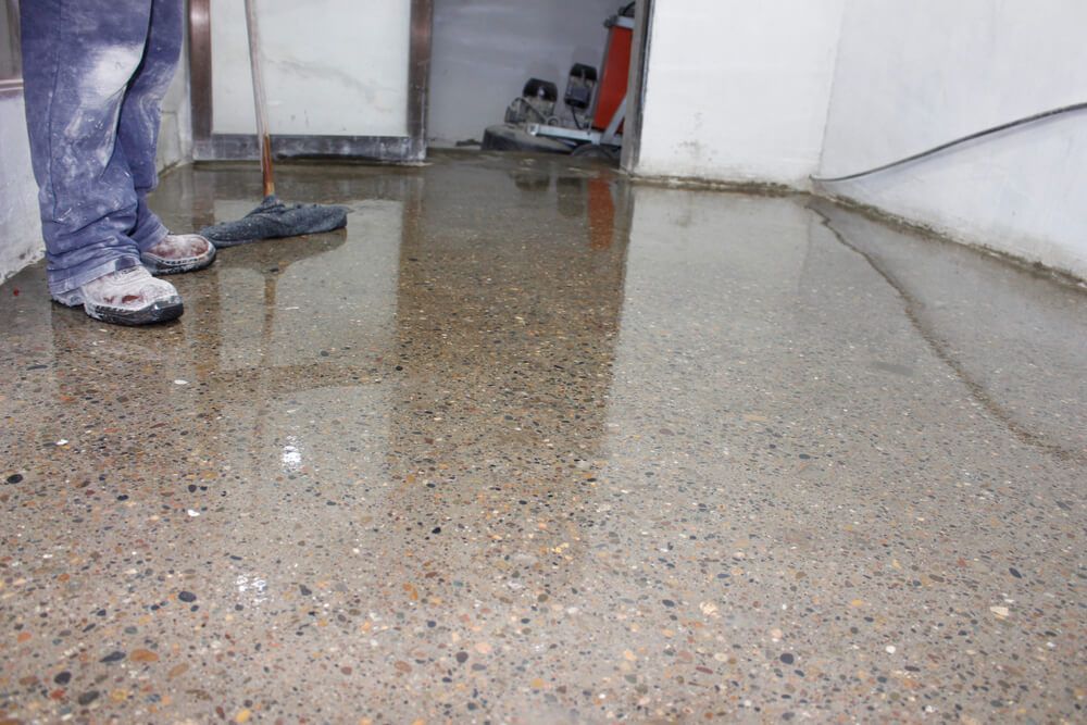 An Garage With Durable and Stylish Epoxy Flooring — Central Coast Property Maintenance Services In Umina Beach, NSW