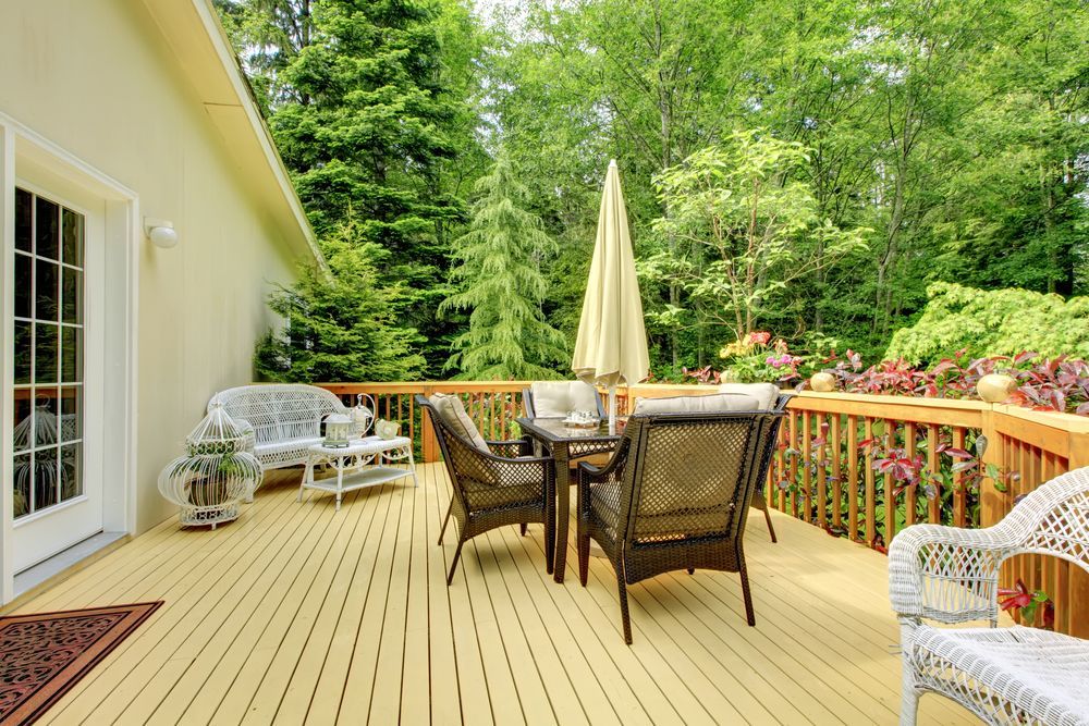 A Deck With a Table and Chairs — Central Coast Property Maintenance Services In Kariong, NSW