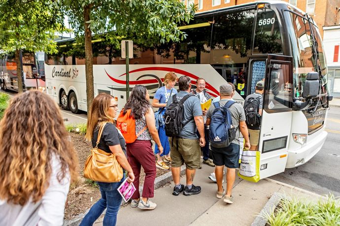 People getting on the bus for the tours