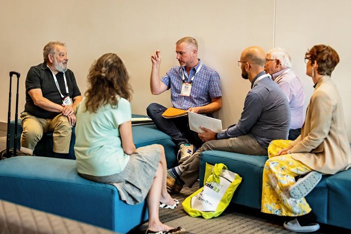a man with a name tag that says ' carlo ' on it