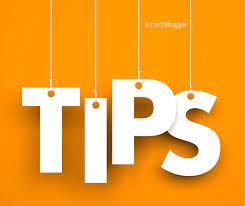 The word tips is hanging from strings on an orange background.