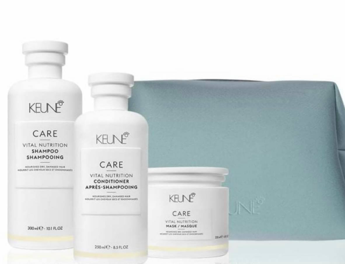 Keune Vital Nutrition hair care set in white bottles and blue bag.
