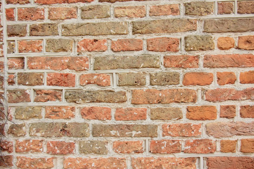 A Close Up Of A Brick Wall With A Lot Of Bricks — Heritage Bricklaying & Remedial Services In Erina, NSW