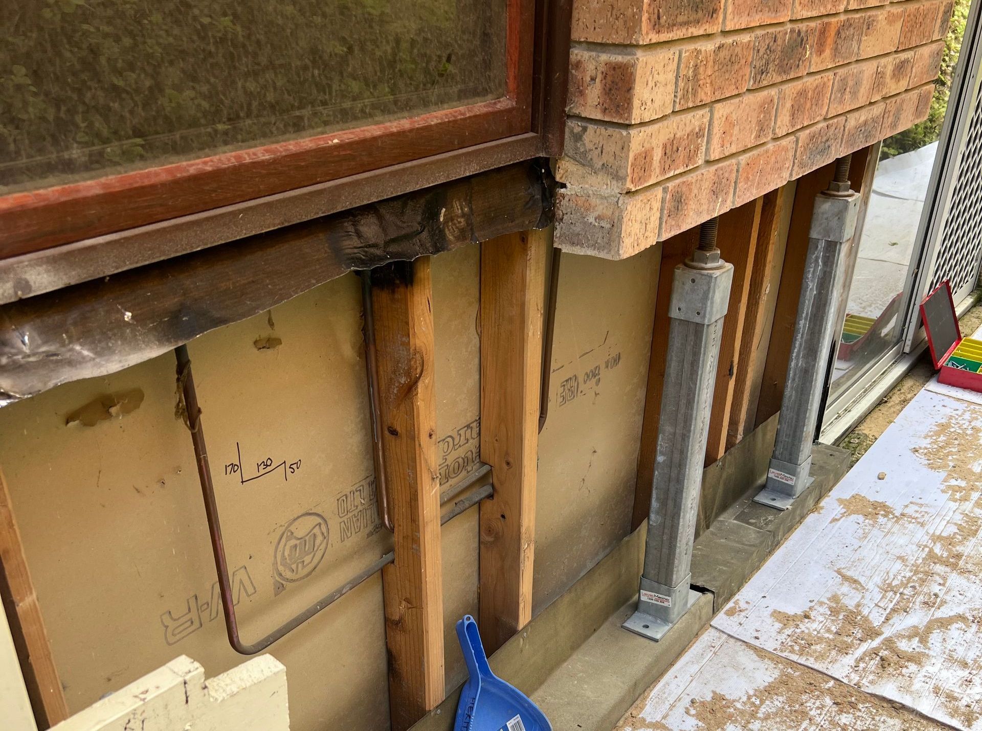 A Stipped-Back Wall Showing All The Layers Inside, Brick, Timber, And Reinforcing — Heritage Bricklaying & Remedial Services In Jilliby, NSW