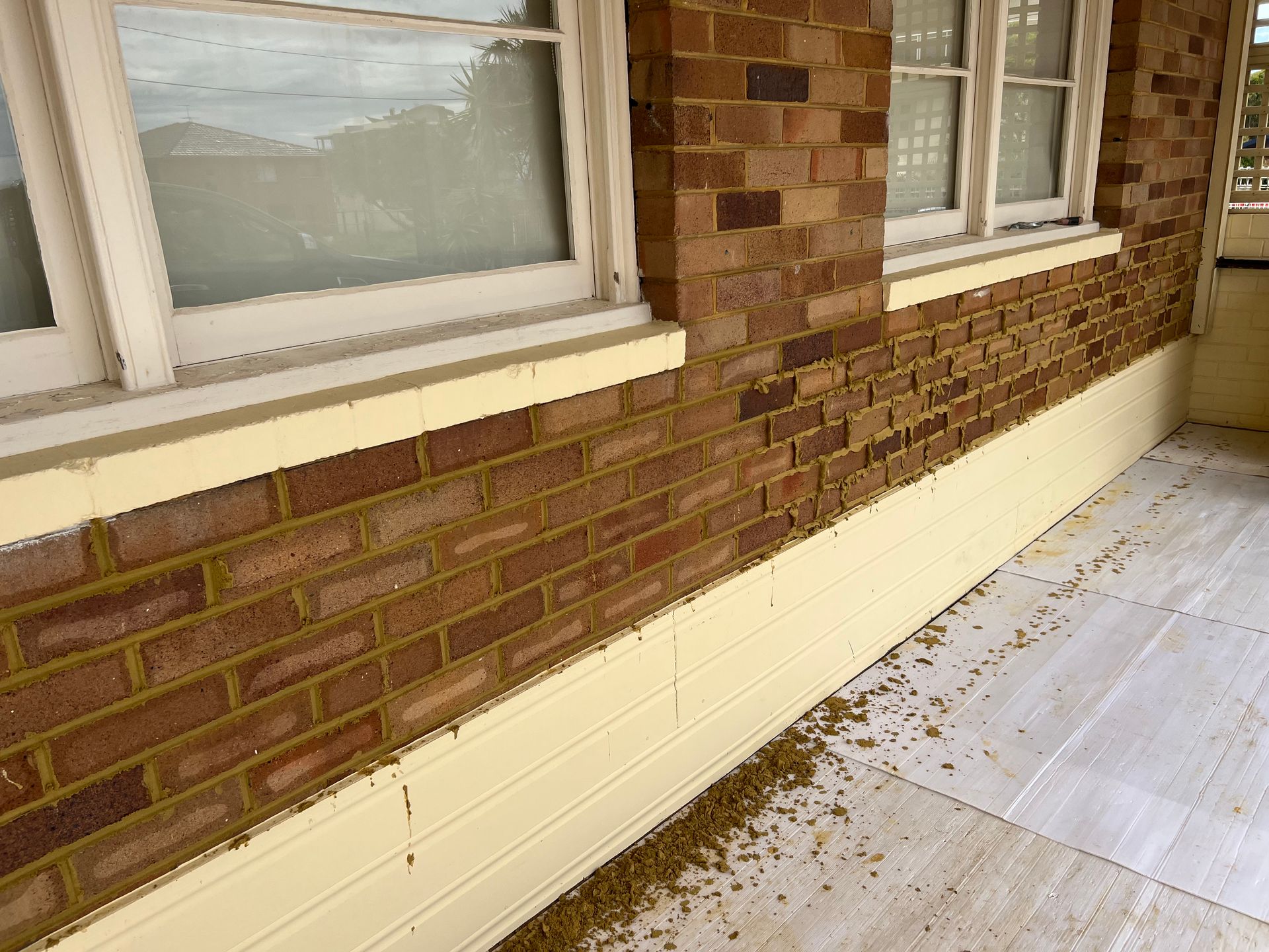 A Brick Wall Being Fixed With New Mortar — Heritage Bricklaying & Remedial Services In Jilliby, NSW