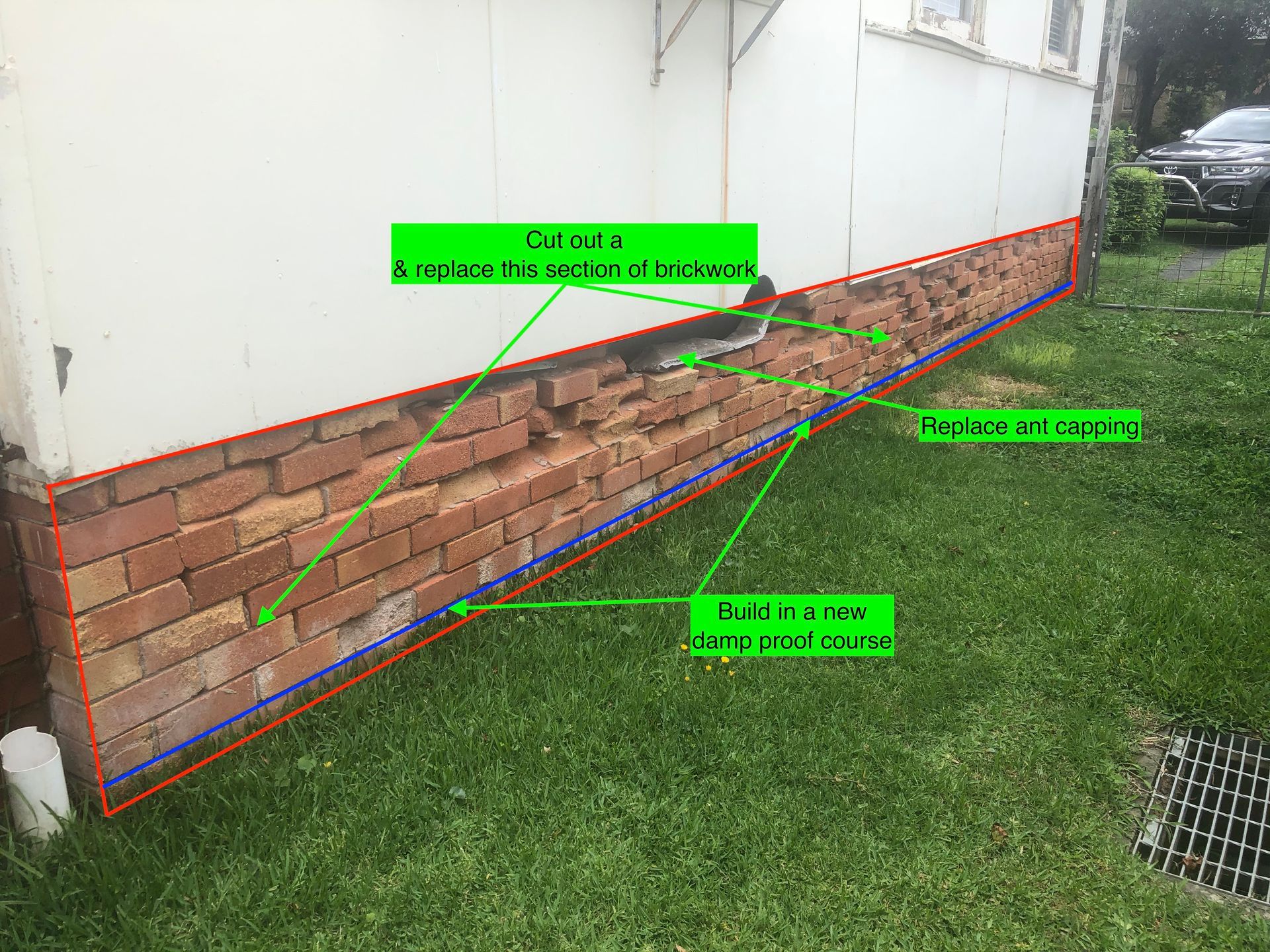 A Brick Wall With Holes In It Is Sitting On Top Of A Lush Green Lawn — Heritage Bricklaying & Remedial Services In Jilliby, NSW