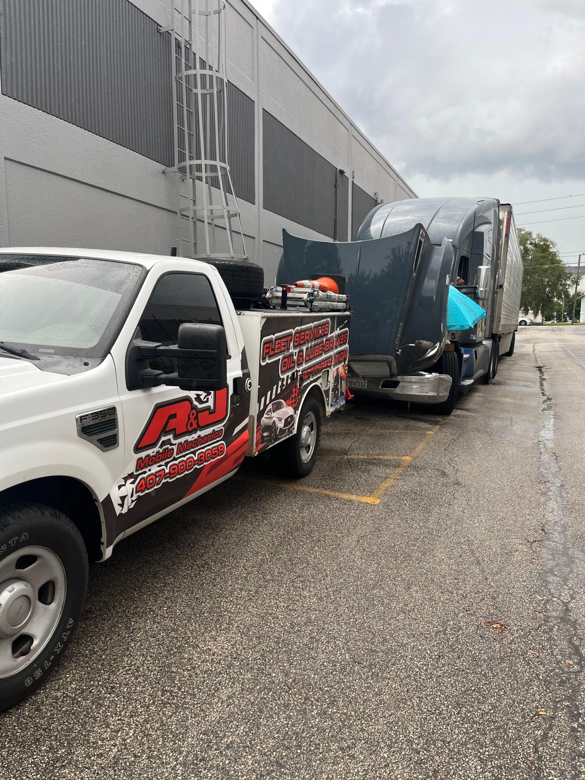 A mechanic is working on the air conditioning system of a car.