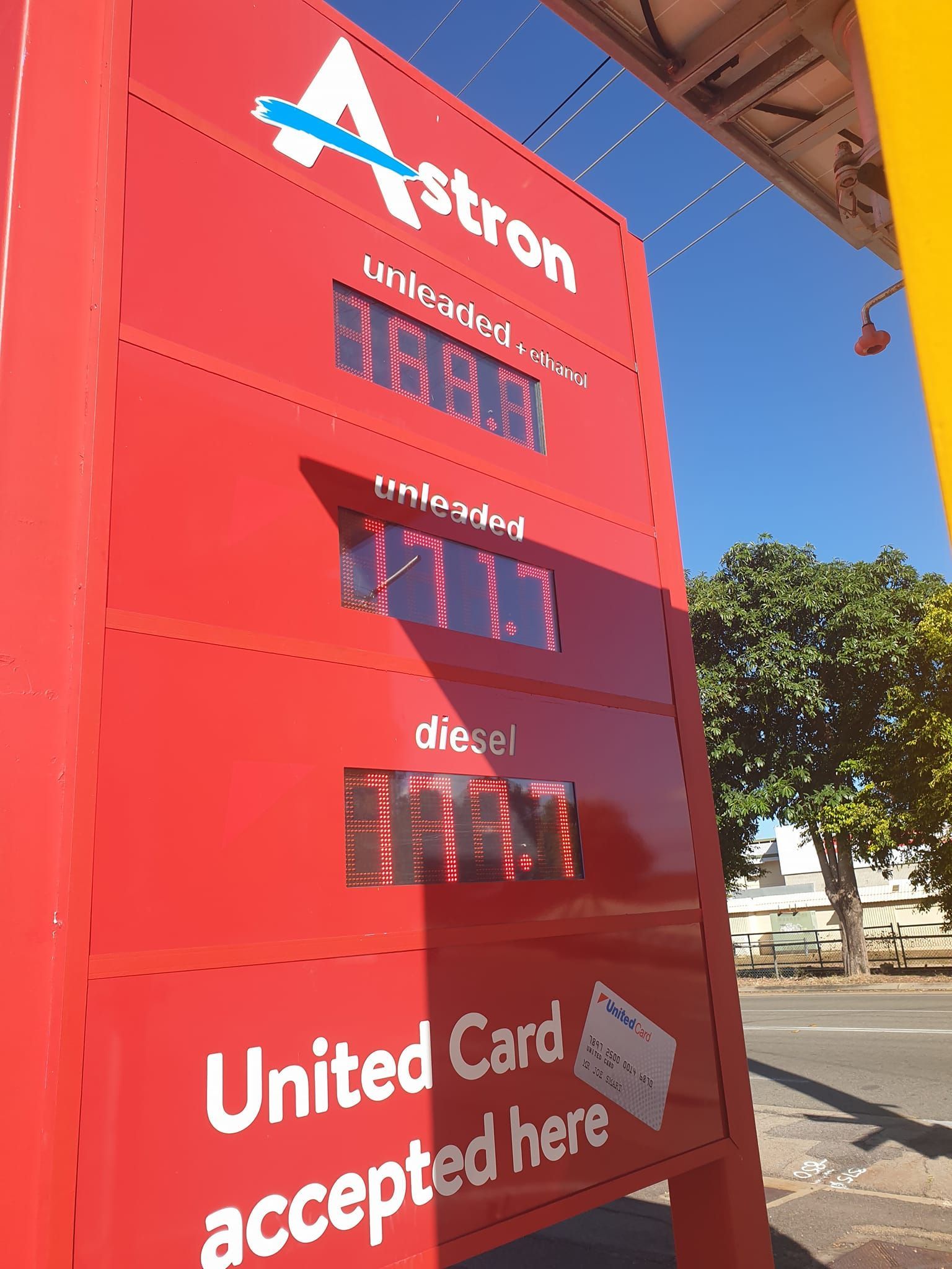 A red sign that says united card accepted here